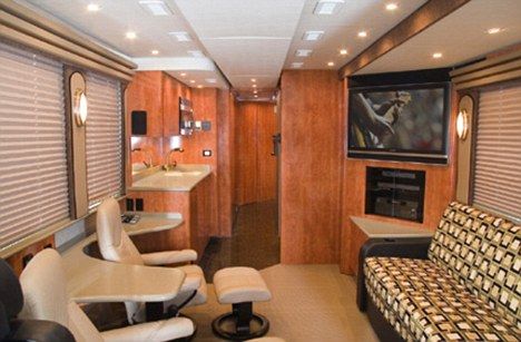Luxury: Guests using the coach can put their feet up and relax in front of the huge entertainment system