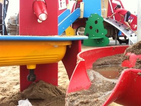 The sandbox at the new Castle Downs playground encourages mud pies. Photo by Elise Stolte / Edmonton Journal