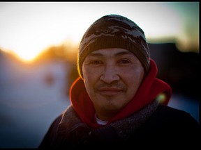 Canadian Ranger John Tinqui from Whati, N.W.T. poses for a portrait at Forward Operating Base Maiden 1 as he helps teach the Canadian Military Arctic survival skills during exercise Arctic Ram. Photo by Ryan Jackson / Edmonton Journal