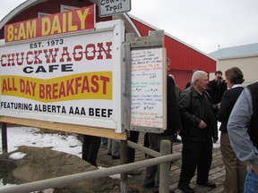 Conservative Leader Alison Redford talks with Jim McCreary outside the Chuckwagon Cafe in Turner Valley on March 27, the second day of the provincial election campaign.