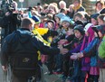 Rick Hansen greats crowds of school children in Beaumont March 12, 2012. Photo by Bruce Edwards / Edmonton Journal