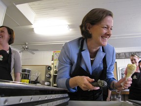 Progressive Conservative leader Alison Reford constructs a triple-scoop ice cream cone at MacKay's ice cream in Cochrane on April 10, 2012.