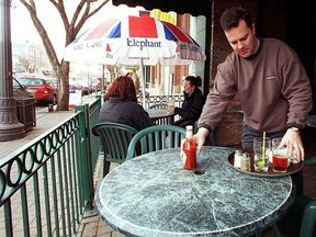 Greg Crawford opens the patio at Whyte Avenue's Elephant and Castle. Picture was shot in 2000. Photo by Larry Wong / Edmonton Journal