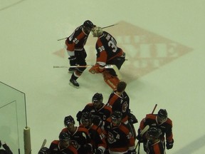 Goalie Tyler Bunz and forward Emerson Etem, shown here celebrating an overtime win in Red Deer in January, were the two main reasons that Medicine Hat Tigers remained strong contenders in the WHL this season.
