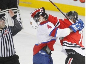 In a microcosm of the night's events, Portland's Joe Morrow gives Edmonton's Keegan Lowe an old-fashioned face wash.