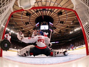 We don't need bigger nets, we need smaller pucks! This one -- a deflected point shot by New York's Marc Staal -- managed to find a hole in Braden Holtby to decide Monday night's Rangers-Caps slugfest in overtime.