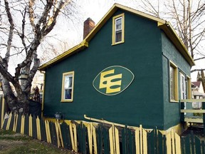 Dave McGregor gave the Bonnie Doon house its first green-and-gold makeover in 1997 and the colours remain to this day, though perhaps a little worse for wear. Photo by Brian Gavriloff / Edmonton Journal