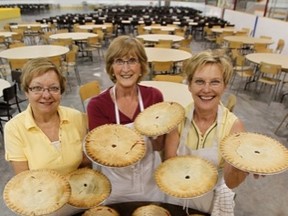 From left to right, Lorretta Johnston, Diane Smith and Chris Johanneson show off some of the 250 pies were part of Josephburg's annual chicken supper on June 13, 2012.