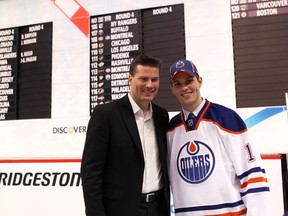 Dillon Simpson stands with his father Craig after being drafted by the Oilers