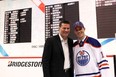 Dillon Simpson stands with his father Craig after being drafted by the Oilers