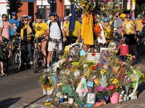 Cyclists gathered around a memorial for Isaak Kornelsen. Photo by Shaughn Butts/Edmonton Journal