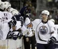 Edmonton Oilers center Sam Gagner, right, celebrates with teammates after scoring a goal against the Dallas Stars in the first period of a hockey game, Monday, Dec. 10, 2007, in Dallas. (AP Photo/Matt Slocum)