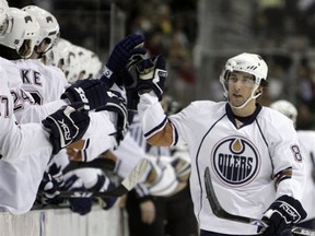 Edmonton Oilers center Sam Gagner, right, celebrates with teammates after scoring a goal against the Dallas Stars in the first period of a hockey game, Monday, Dec. 10, 2007, in Dallas. (AP Photo/Matt Slocum)