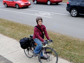 Chris Chan stands for a photo near 76 Avenue and 106 Street, where a bike lane suddenly turns into a shared use lane. Photo by Larry Wong/Edmonton Journal)