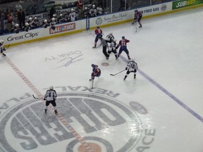 Three Edmonton Oilers prospects were on display at Rexall Place on Sunday afternoon, at times simultaneously. Here David Musil (#6) of Vancouver Giants lines up against Edmonton Oil Kings' linemates Mitch Moroz (#29, breaking into centre of frame) and Travis Ewanyk (#21, who just won this neutral zone draw to the side boards).