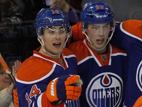 Logos have been changed to protect the innocent, but Jordan Eberle and Ryan Nugent-Hopkins seem destined for more shared goal celebrations in 2012-13.
(Rick MacWilliam/EDMONTON JOURNAL)