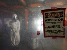 Workers remove asbestos and demolish the interior of the old Charles Camsell Hospital on May 26, 2010.