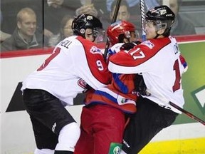 Nail Yakupov is sandwiched by two Canadians in the first minute of a November game between a touring Russian side and a Canadian squad selected from WHL teams.