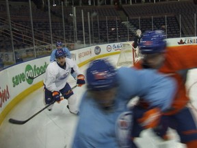 This just in: When seen from ice level NHL players are FAST! Ales Hemsky shrugs off Justin Schultz as he turns the corner. Behind: Jordan Eberle, Sam Gagner, Devan Dubnyk. (Photos: Bruce McCurdy)