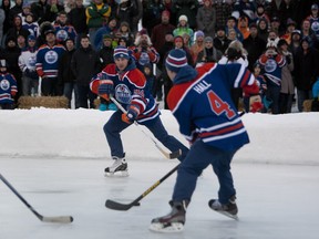 EDMONTON ALTA.: JANUARY 13, 2013--Edmonton Oilers Ryan Smyth passes the puck to Taylor Hall during a game of shinny for fans on a rink at Hawrelak Park on January 13, 2013 in Edmonton. Greg Southam/Edmonton Journal