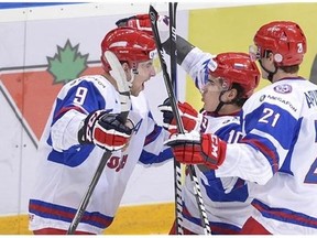 Russian captain Nail Yakupov (centre) celebrates a powerplay goal against Canada in last Saturday's bronze medal game in Ufa. (Photo: Canadian Press/Nathan Denette)