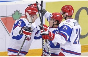 Russian captain Nail Yakupov (centre) celebrates a powerplay goal against Canada in last Saturday's bronze medal game in Ufa. (Photo: Canadian Press/Nathan Denette)