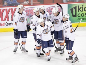 Hail, hail, the gang's all here -- the OKC Barons have nurtured a rich cluster of young talent during the lockout. Here a sextet of future Oilers awaits a video review, having scored with the goalie out in a mid-Movember game vs. Toronto Marlies. Back row (L-R): Justin Schultz, Teemu Hartikainen, Ryan Nugent-Hopkins, Anton Lander; Front row: Jordan Eberle, Taylor Hall
(Photo: Steven Christy/OKC Barons)