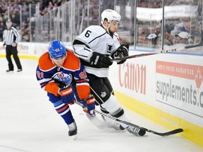 Magnus Paajarvi of the Edmonton Oilers tries to rub out Jake Muzzin of the Los Angeles Kings at Rexall Place in Edmonton February 19, 2013.
Photograph by: Shaughn Butts , Edmonton Journal