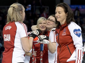 Ryan Remiorz/The Canadian Press

Team Canada's Beth Iskiw and, from left, Laine Peters, Jessica Mair and skip Heather Nedohin celebrate after an end on their way to defeating British Columbia's Kelly Scott 8-4 in the Page Playoff 3-4 game at the Scotties Tournament of Hearts Canadian women's ciurling championship on Saturday, Feb. 23, 2013, at Kingston, Ont.
