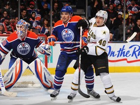 Mark Fistric battles for position in front of Edmonton's net. (Photo: Derek Leung/Getty Images)