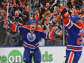 SCRATCH THAT ITCH: Ryan Smyth celebrates the game-winning goal he has just helped engineer with, get this, 94 seconds left in the Edmonton Oilers' thrilling comeback win over Colorado Avalanche Saturday. While Magnus Paajarvi got credit for the goal, this had to be a sweet moment for Smytty. (Photo by Derek Leung/Getty Images)
