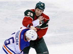 Matt Kassian doing what he seemingly does best, grappling with Darcy Hordichuk last season. This week both scrappers have been waived by their respective NHL clubs.
(Photograph by: Hannah Foslien/Getty Images, edmontonjournal.com)