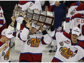 Edmonton Oil Kings' Keegan Lowe, Henrik Samuelsson and T.J. Foster hold the Ed Chynoweth Cup after defeating the Portland WinterHawks 4-1 in game 7 of the WHL championship series on May 13, 2012 in Edmonton.
Photograph by: Greg Southam