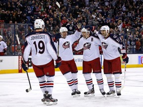Columbus Blue Jackets celebrate a goal in their win over Detroit on Saturday - a win that moved them out of last place in the Western Conference. (Photo: Kirk Irwin/Getty Images)