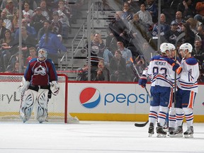 Edmonton Oilers forwards celebrate Shawn Horcoff's first period goal, the first of four on the night for the team. (Photo: Michael Martin, Getty Images)