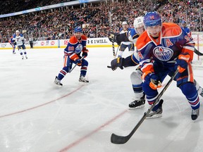 Jordan Eberle competes for the puck in the corner Saturday night as a full house looks on. The Oilers lost 3-0. (Photo: Andy Devlin/Getty Images)