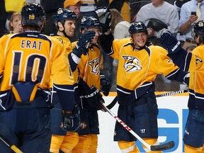 Sergei Kostitsyn smiles after scoring Nashville's first goal; the Predators would go on to survive a shaky third after dominating the Oilers over the first two periods. {Photo: John Russell/Getty Images)