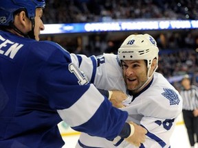 Mike Brown takes on B.J. Crombeen of the Tampa Bay Lightning, in first period of NHL game, Feb, 19, 2013 in Tampa, Fla.  (Brian Blanco/AP)