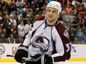 FILE - In this April 1, 2011 file photo, Colorado Avalanche's Ryan O'Reilly smiles after scoring the game-winner against the Phoenix Coyotes during a shootout in an NHL hockey game in Glendale, Ariz. O'Reilly practiced with the Avalanche team on Saturday, March 2, 2013, a little more than 36 hours after the team matched the offer sheet he signed with the Calgary Flames NHL hockey team. O'Reilly, Colorado's leading scorer last season, said he put his faith in his agent to get a deal done. (AP Photo/Ross D. Franklin, file)