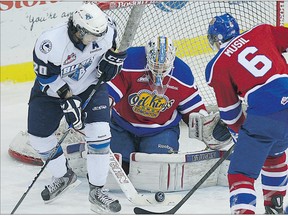 Saskatoon Blades right wing Josh Nicholls, left, looks for the puck in front of Edmonton Oil Kings goaltender Laurent Brossoit and defenceman David Musil at the Credit Union Centre on Jan. 23. The Oil Kings won 4-2.
Photograph by: Greg Pender, The StarPhoenix
