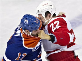 Detroit Red Wings' Jordin Tootoo (22) and Edmonton Oilers Mike Brown fight during the second period of an NHL hockey game Friday, March 15, 2013, in Edmonton, Alberta. (AP Photo/The Canadian Press, Jason Franson)