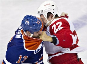 Detroit Red Wings' Jordin Tootoo (22) and Edmonton Oilers Mike Brown fight during the second period of an NHL hockey game Friday, March 15, 2013, in Edmonton, Alberta. (AP Photo/The Canadian Press, Jason Franson)