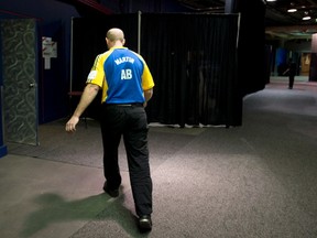 Alberta skip Kevin Martin leaves the ice surface after loosing to Northern Ontario during the afternoon draw at the Tim Hortons Brier in Edmonton on March 4, 2013. Photo by Jonathan Hayward, The Canadian Press