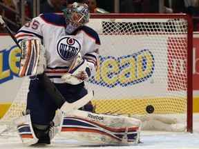 CHICAGO, IL - FEBRUARY 25: Nikolai Khabibulin #35 of the Edmonton Oilers makes a save against the Chicago Blackhawks at the United Center on February 25, 2013 in Chicago, Illinois. The Blackhawks defeated the Oilers 3-2 in overtime.(Photo by Jonathan Daniel/Getty Images)