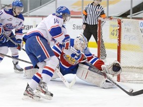 Regina Pats’ Morgan Klimchuk races to the loose puck in front of Edmonton Oil Kings’ goalie Laurent Brossoit in first period WHL action at the Brandt Centre on Wednesday, March 6, 2013.
Photograph by: TROY FLEECE, Regina Leader-Post