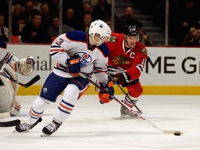 Ryan Nugent-Hopkins leads the charge out of Edmonton Oilers territory against Jonathan Toews and the Chicago Blackhawks. (Photo: Jonathan Daniel/Getty Images North America)