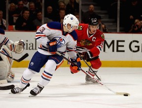 Ryan Nugent-Hopkins leads the charge out of Edmonton Oilers territory against Jonathan Toews and the Chicago Blackhawks. (Photo: Jonathan Daniel/Getty Images North America)