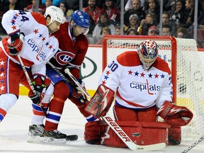 Roman Hamrlik battles his best friend Erik Cole for position at Michal Neuvirth's crease in a game last season. (Photo: Richard Wolowicz/Getty Images North America)