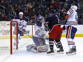 How can a 5'7 forward screen a 6'5 goalie? If defensive help is a day late and a dollar short, that's how. Here little Cam Atkinson makes Devan Dubnyk's life miserable on Jack Johnson's game-tying goal, while Nick Schulz and Sam Gagner look on from outside. (Photo: Kirk Irwin/Getty Images)