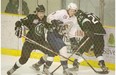 Mike Williamson of the Spruce Grove Saints, tries to break through Josh Healey and Bowen Croft of the Sherwood Park Crusaders of the Alberta Junior Hockey League playing at Grant Fuhr Arena in Spruce Grove. Photo by Shaughn Butts, Edmonton Journal